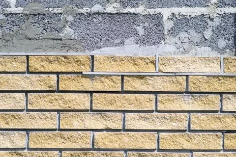 Wall cladding with decorative bricks, front view. Material for decorating the Fotos Stock