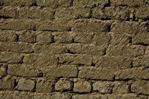 Wall of clay bricks Stock Photos