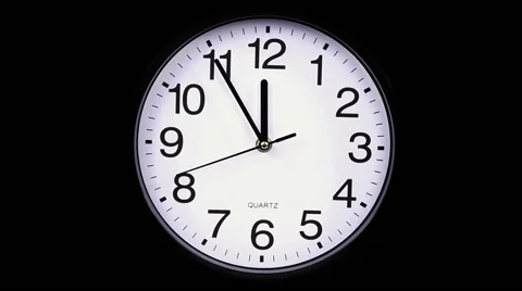 Wall clock on a black background 23:55 库存影片 58247245