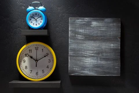Wall clock at black Stock Photos
