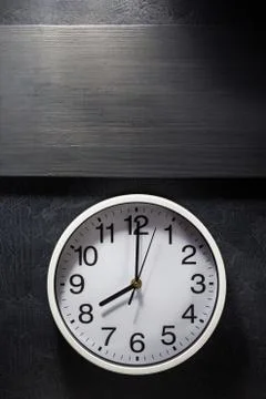 Wall clock at black Foto stock