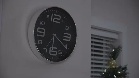 Wall clock in Christmas evening. Stock Footage 145786613
