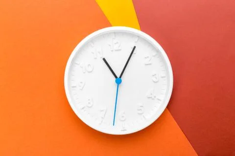 Wall Clock on color background. creative photo Stock Photos