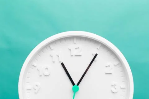Wall Clock on color background. creative photo. Stock Photos