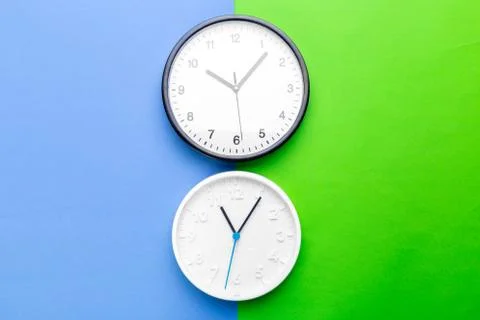 Wall Clock on color background. creative photo. Stock Photos