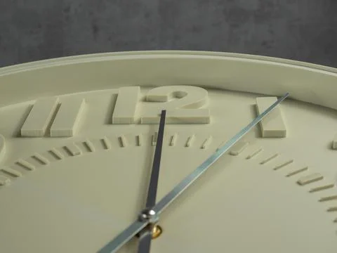 Wall clock on a gray background. Clock close up. Stock Photos