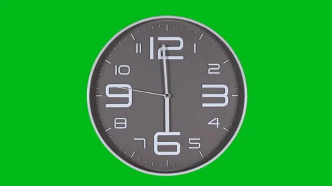 Wall clock on a green background 库存影片 123914618