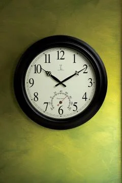 Wall Clock on Green Stock Photos