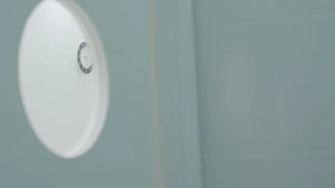 Wall clock in hospital. Action. View of wall clock from round door window. Time Video stock 148337679
