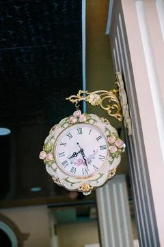 A wall clock hung on a wall, its hands ticking away the moments, symbolizin.. Stock Photos
