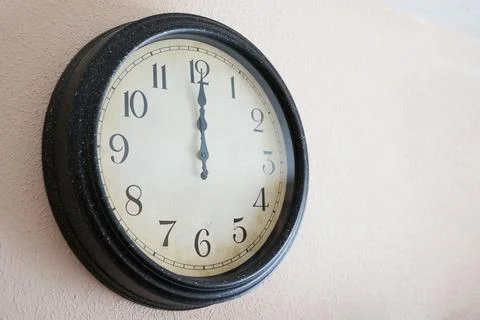 Wall clock marking twelve o'clock on the new year Foto stock