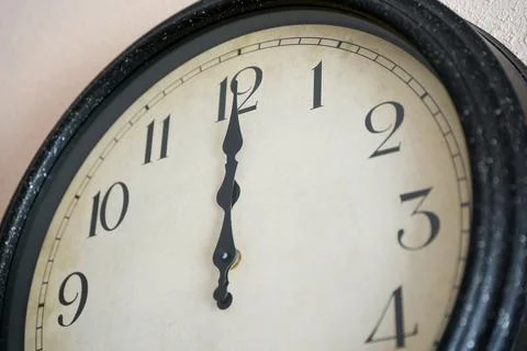 Wall clock marking twelve o'clock on the new year Foto stock