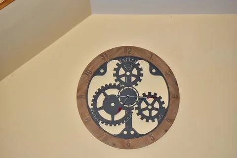 Wall clock with mechanic gears inside Stock Photos