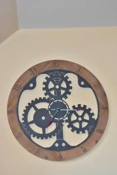 Wall clock with mechanic gears inside Stock Photos