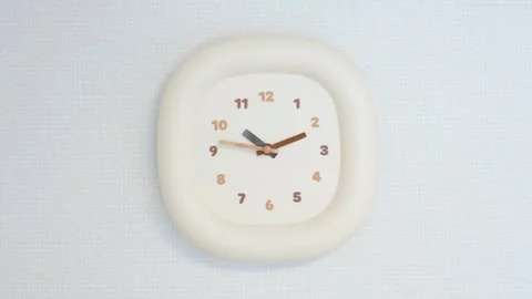 Wall clock with minute and second hands on gray background. Stock Footage 321339167
