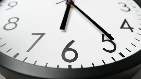 Wall clock show running time. Time lapse. Clock face on white background. Stock Footage 295439430