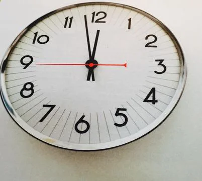 Wall clock showing time Stock Photos
