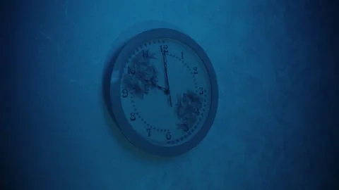 Wall clock shows 10 pm in a room under blue light with a smooth second hand Stock Footage 247800530