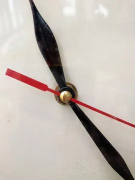The wall clock shows the time. Stock Photos