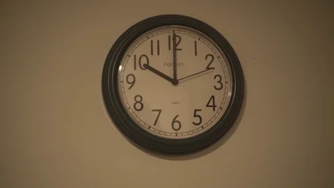 Wall Clock Ticks Handheld Suspense Video stock 72878913