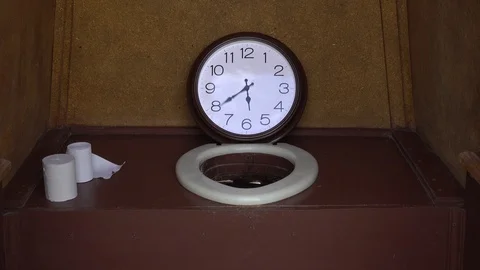 Wall Clock in the toilet. Stock Footage 92348137