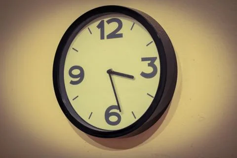 Wall clock on wall Stock Photos