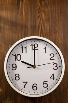 Wall clock on wood Stock Photos