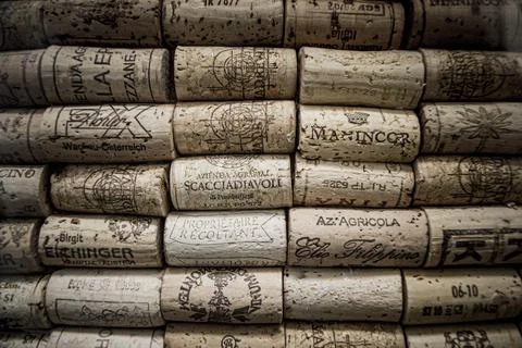 Wall of collection of wine corks from different wineries and brands Stock Photos