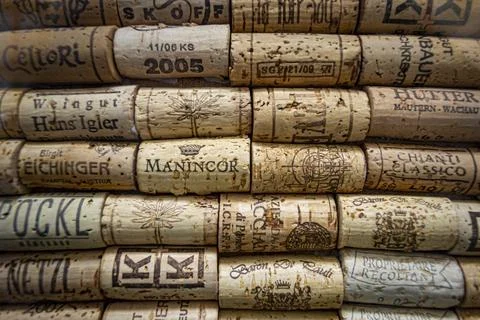 Wall of collection of wine corks from different wineries and brands Stock Photos