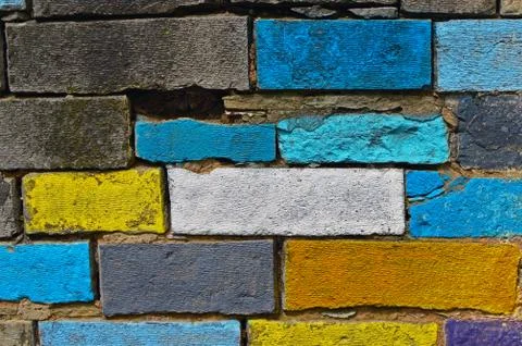 A wall with a colored painted brick Stockfoto's
