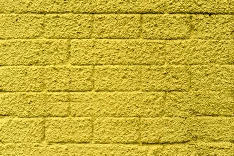 Wall of concrete blocks, painted in different colors Stock Photos