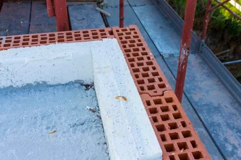 Wall construction with insulation in construction site Stock Photos