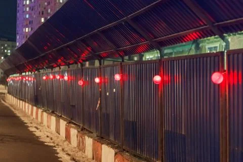 Wall on a construction site with red light bulbs Stock Photos