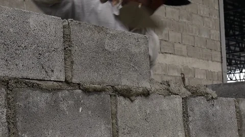 Wall construction worker build concrete wall by cement block. Stock Footage 76335828