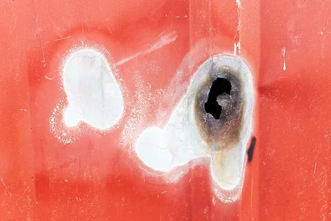 Wall of the container with a hole from welding Stock Photos