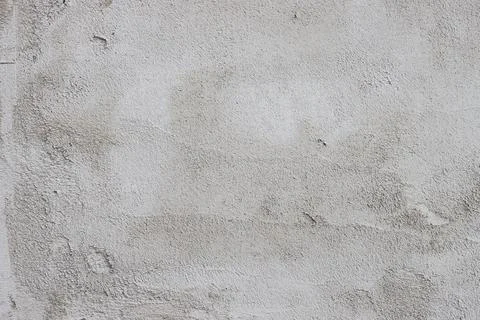 The wall is covered with rough putty. Stock Photos