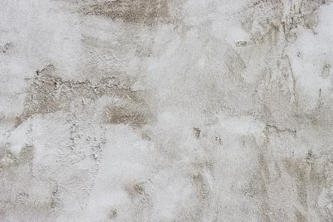 The wall is covered with rough putty. Stock Photos