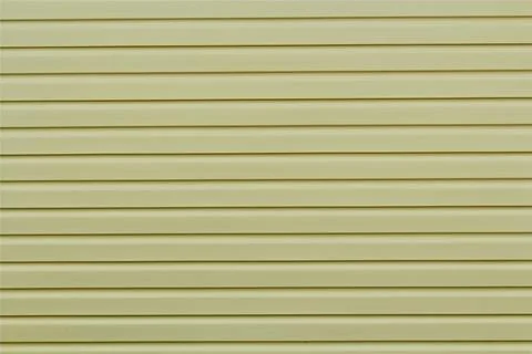 The wall is covered with siding. Stock Photos