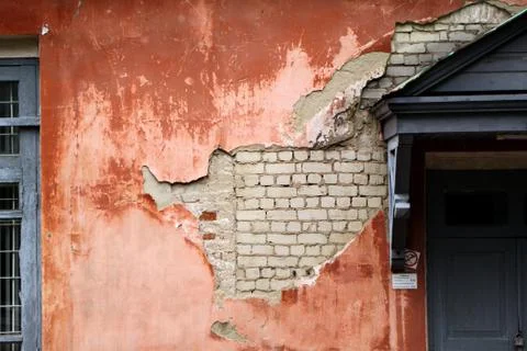 The wall with the damaged paint coating Stock Photos