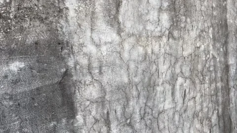 Wall Damaged by Rain | Small Cracks and Faded Paint Close-Up 動画素材 318395335