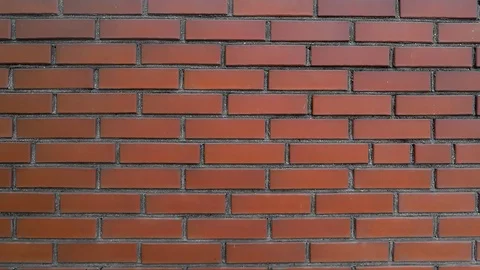 Wall of dark red brick, smooth movement of the camera Stock Footage 124026725