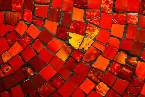 Wall decor lined with red mosaic on the wall. natural materials for decoration Photos