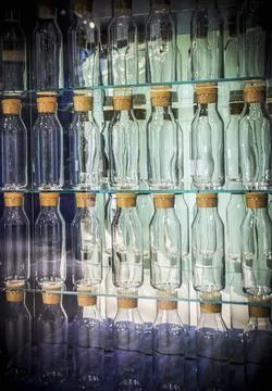 A wall decorated with bottles Stock Photos
