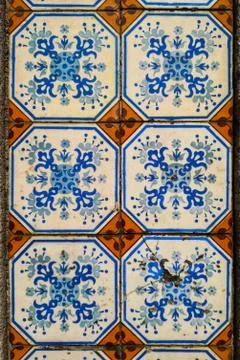 Wall decorated with tiles of various models Stock Photos