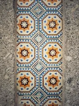 Wall decorated with tiles of various models Stock Photos