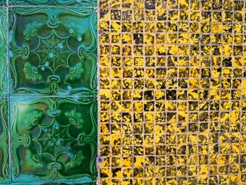 Wall decorated with tiles of various models Stock Photos