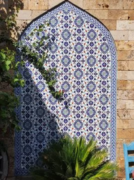 Wall decoration with painted tiles Stock Photos