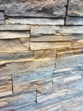 Wall of designer bricks. Textured Background. Stock Photos
