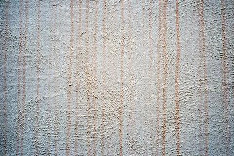 A wall displays a surface with vertical lines and patterns Stock Photos