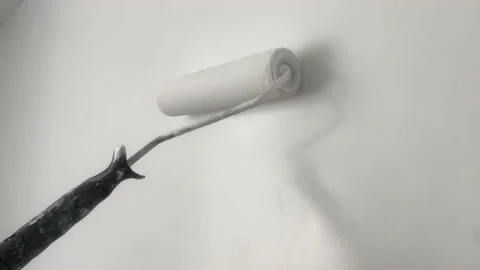 Wall dyeing. Painter paints white wall with a paint roller Stock-Footage 202006657